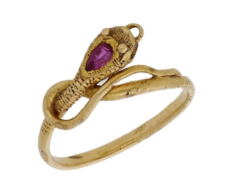 A 19th century gold and ruby serpent ring, the coiled serpent head with engraved scale pattern and bezel-set with a pear-shap