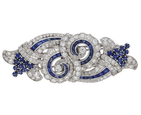 An Art Deco sapphire and diamond double clip brooch, of scroll and foliate design design, set throughout with calibré and cir