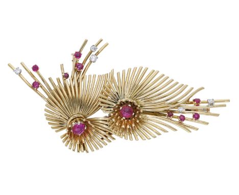 A ruby and diamond combination brooch retailed by Garrard & Co., circa 1957, the two sprays formed of polished wires and each