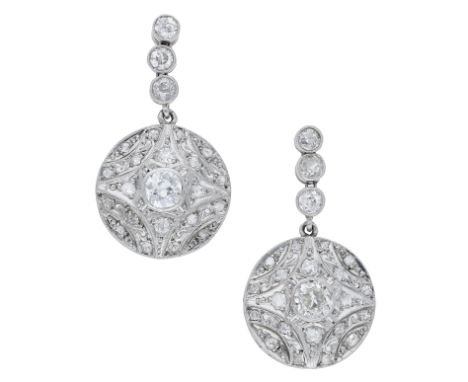 A pair of diamond ear pendants, the articulated surmounts each above a circular drop, set throughout with old-brilliant and r