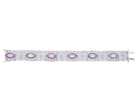 A ruby and diamond bracelet, set with six marquise-shaped diamonds, each within a surround of calibré-cut rubies, to a pierce