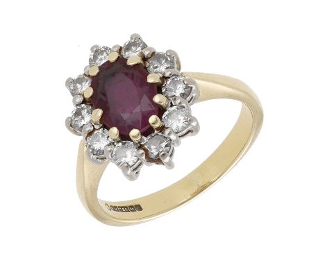 A ruby and diamond cluster ring, the oval-cut ruby within a surround of brilliant-cut diamonds, mounted in 18ct gold, UK hall