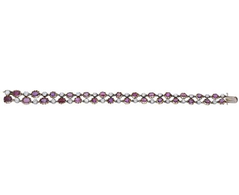 An antique ruby and diamond bracelet, converted from a 19th century jewel, designed as two rows of alternating oval-cut rubie