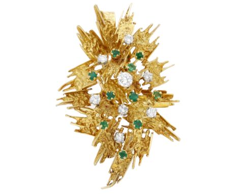 An emerald and diamond pendant, circa 1970, the abstract cluster of shaped textured panels, accented with circular-cut emeral