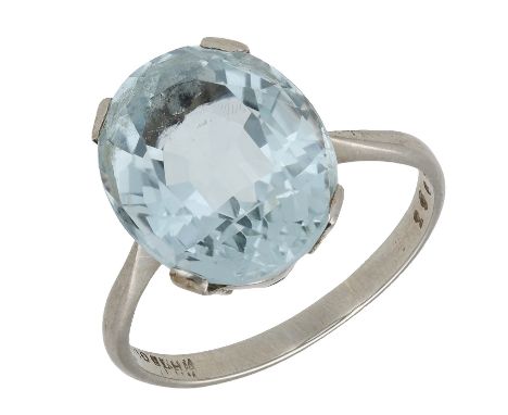 An aquamarine single stone ring, the oval-cut aquamarine between tapered shoulders, stamped ‘WHITE GOLD’, numbered, ring size