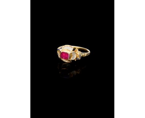 A rare Elizabethan ruby and enamel ring, circa 1560-1580, the rectangular table-cut ruby collet set within a raised quatrefoi