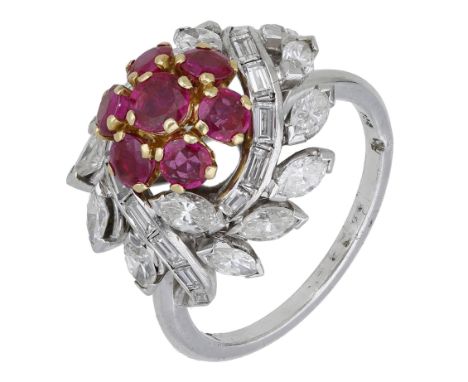 A ruby and diamond dress ring, circa 1950, designed as two foliate swirls set with marquise and baguette-cut diamonds, with l