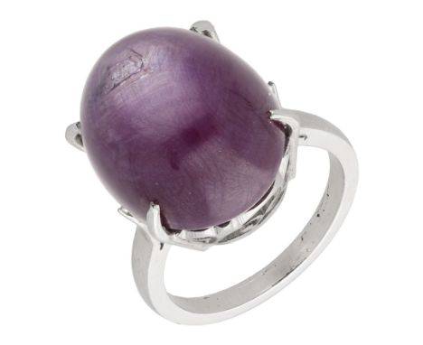 A star ruby dress ring, the star ruby cabochon to a pierced scrollwork gallery, ring size O.  £300-£500  ---  Condition Repor