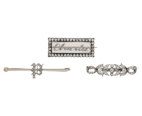 Three antique diamond brooches, comprising a foliate and ribbon brooch (adapted), an initial ‘P’ brooch and a brooch with app