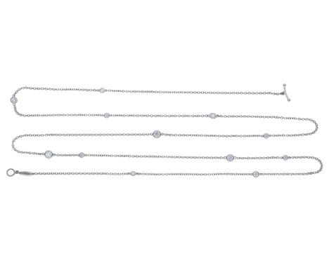 A platinum ‘Diamonds by the Yard’ necklace by Elsa Peretti for Tiffany & Co., the cable-link chain spectacle-set with graduat