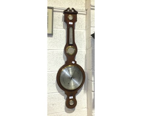 A modern mahogany banjo barometer, 104cm high.