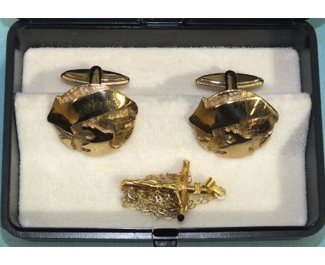 A pair of 9ct gold cufflinks, gross weight 10.8g and a 9ct gold crucifix on chain, 1.1g, (2).