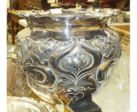 A plated jardinière in the Art Nouveau style, with embossed floral decoration, 18cm high, 20cm diameter, a plated salver, loo