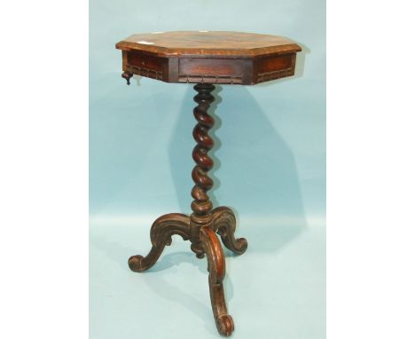 A Victorian rosewood octagonal work table on twist column and tripod support, 44cm wide, 77cm high.