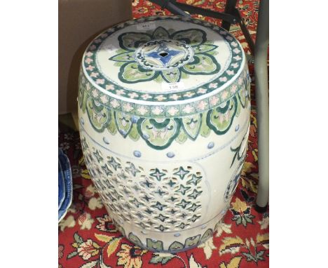 A reproduction Oriental ceramic garden seat of barrel shape, 45cm high.