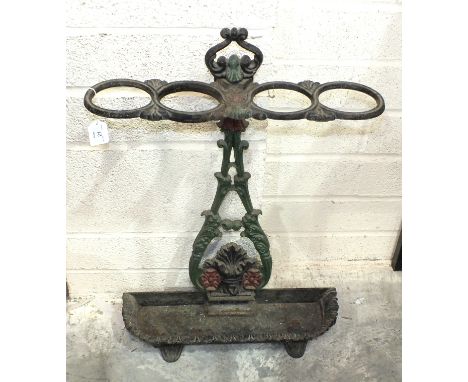 A cast iron stick stand with drip tray, 69cm high.