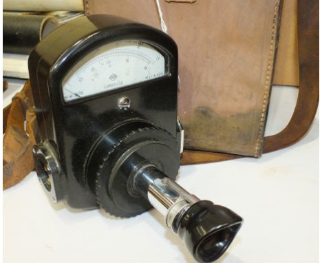 A Cambridge Disappearing Filament Pyrometer in leather case and a black marble mantel clock with French drum movement and whi