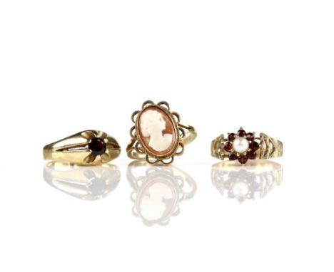 Three vintage rings, a shell cameo ring, size M 1/2, another 1970's pearl and red paste cluster, size Q 1/2 and a 1980's roun