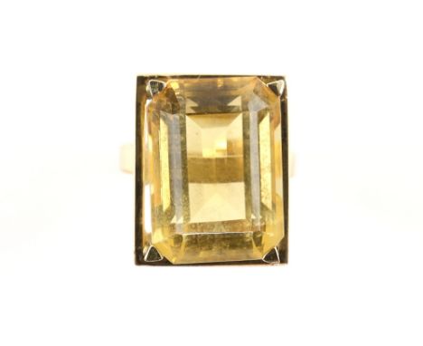 Citrine dress ring, emerald cut mid-yellow citrine weighing an estimated 16.84 carats, testing as 14 ct, with a higher platin