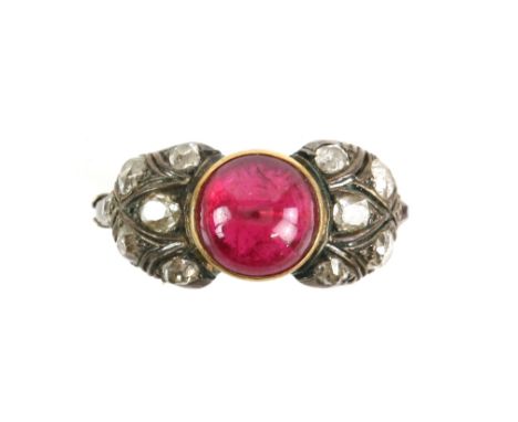 Old cut diamond and synthetic ruby ring; featuring a central circular cabochon cut synthetic ruby, estimated 3.00 carats, wit