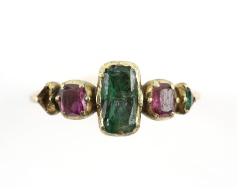 Antique ring, set with central rectangular cut emerald, with rubies and triangular cut emerald set either side, mounted in 18