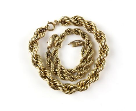Chunky twisted rope chain bracelet with bolt ring clasp and another slimmer bracelet with etched clasp and safety catch, both