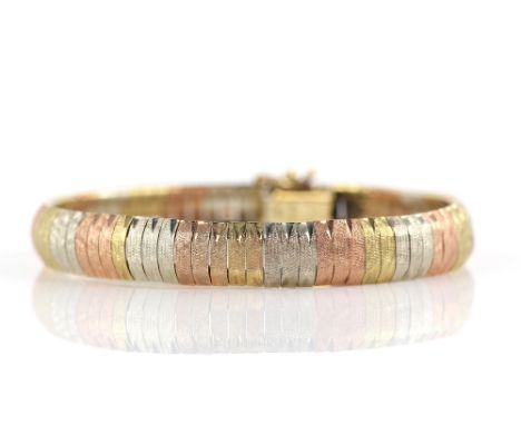 Modern articulated link bracelet, engine turned engraving, in yellow, white and red gold, hallmarked 9 ct, with import marks 