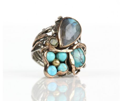 Italian abstract gem set ring, with a pear cut labradorite, round cut peridot and turquoise, mounted in silver, designed as b