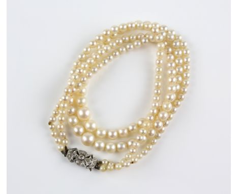 Graduated double row pearl necklace, with old cut and Swiss cut diamond set clasp, 44cm in length            Pearl diameters 
