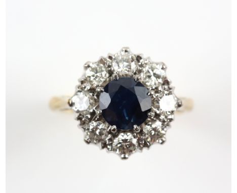 Vintage sapphire and diamond cluster ring, round cut sapphire weighing an estimated 1.64 carat, surrounded by eight diamonds 