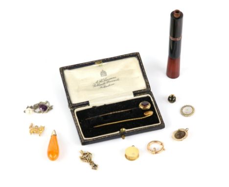 A selection of antique and vintage items including a stick pin featuring a ladies profile testing as 18 ct, a Victorian garne