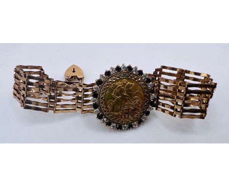 A 1982 Elizabeth II half sovereign in a 9ct gold mount inset with blue stones and cubic zirconia, within a gate bracelet with