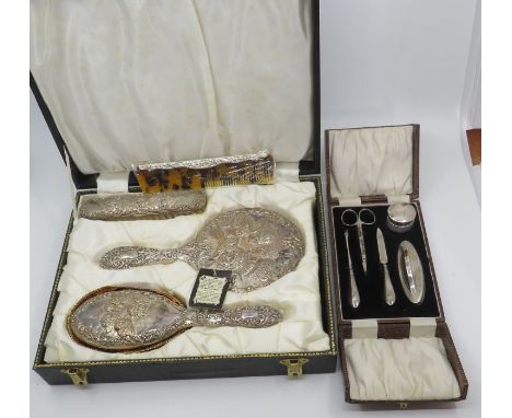 Boxed Silver dressing table set , mirror, hair brush,comb and cloths brush (unused) Birmingham 1935 , together with a boxed s