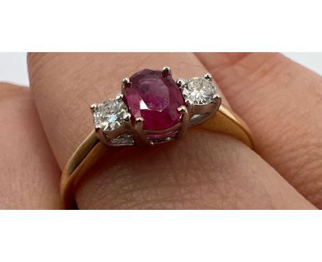 An 18ct gold ruby and diamond ring. Approximate gross weight 2.7 grams. Estimated diamond weight 0.20cts. Size O. Hallmarked 