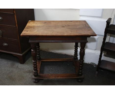 A late 17th Century Dutch oak and walnut small side table the rectangular top raised on four vase and compressed bobbin turne