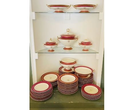 A Worcester porcelain part dinner service with a family crest, 19th Century, each piece with brown printed swan crest within 