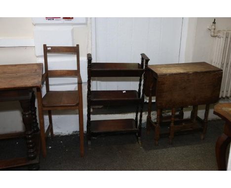 A 1930 oak three tier oak book trough, a child’s highchair circa 1930 and a drop flap table circa 1950
