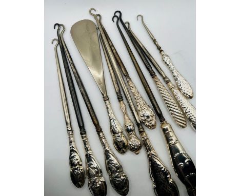 An interesting collection of 11 silver handled button hooks (11)