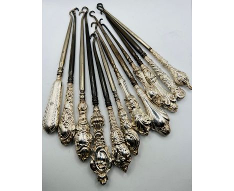 A selection of silver handled button hooks - with a variety of ornamental handles - 12 in number.