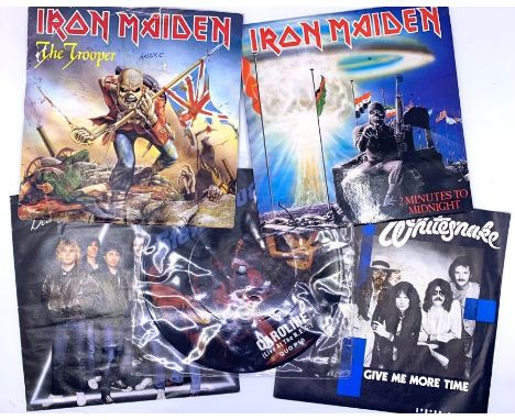 Cased collection of 7" singles, rock &amp; metal, inc. Iron Maiden, Judas Priest, Whitesnake, AC/DC, and others, most without