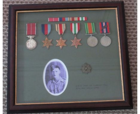 A framed group of WWII medals awarded to Staff SGT Clarence Kall . Royal Army Corps. To include the mertitorious service meda