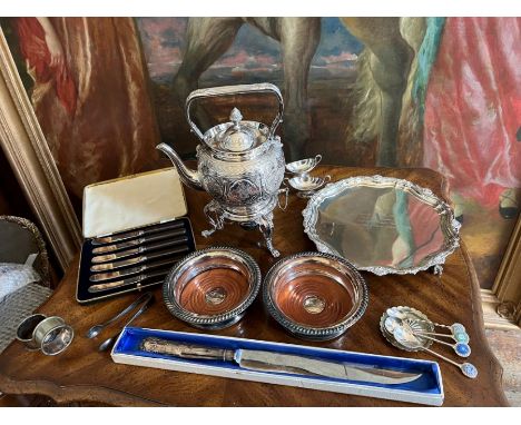 A selection of quality silver plated items to include an Elkington &amp; Co plated teapot and heater stand, a pair of wine co