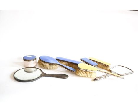 A George V five-piece silver gilt and blue enamel dressing table set, Birmingham 1936, 1937 and 1938, a small powder compact 