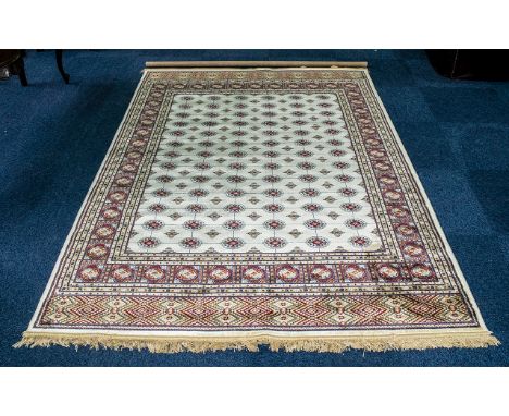 A Genuine Excellent Quality Cashmere Ivory Ground Carpet/Rug. Bukhara design. Measures 2.40 by  1,6 metres. 