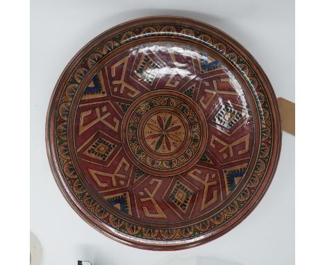 A Moroccan ceramic charger with markings to base, Diameter 40cm 