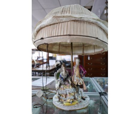 A 19th century porcelain figural group table lamp, with blue and white markers mark to verso, some damage 