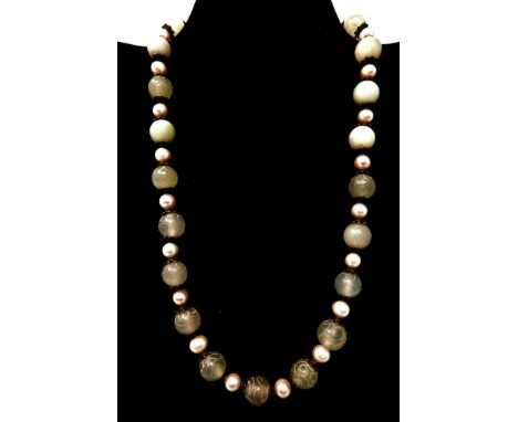 A boxed carved green jade and freshwater pearl necklace, L: 48cm 
