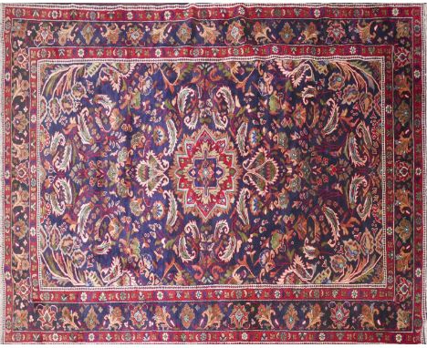 A North West Persian Mahal carpet, central double pendent medallion with repeating spandrels on a sapphire field, complimente