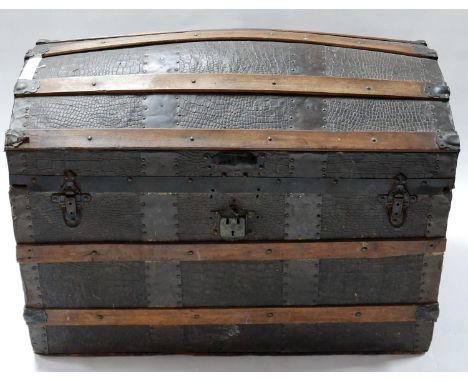 An antique iron bound faux crocodile skin dome top trunk, H.57 W.81 D.50cm 