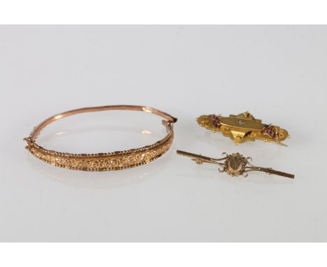 Victorian 9ct gold ruby and diamond set mourning brooch, 3.7g gross, a 9ct gold bangle, 5.2g and an unhallmarked yellow metal